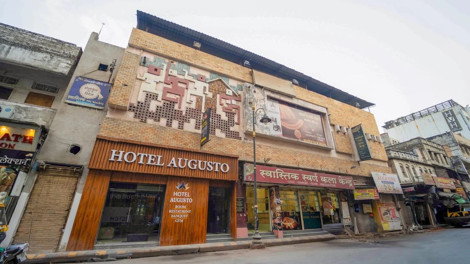 Hotel Augusto’s entrance and sign on August Kunda Road